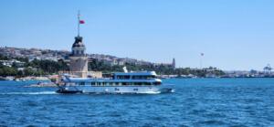 P171 corporate event yacht cruising past Maiden Tower in Istanbul